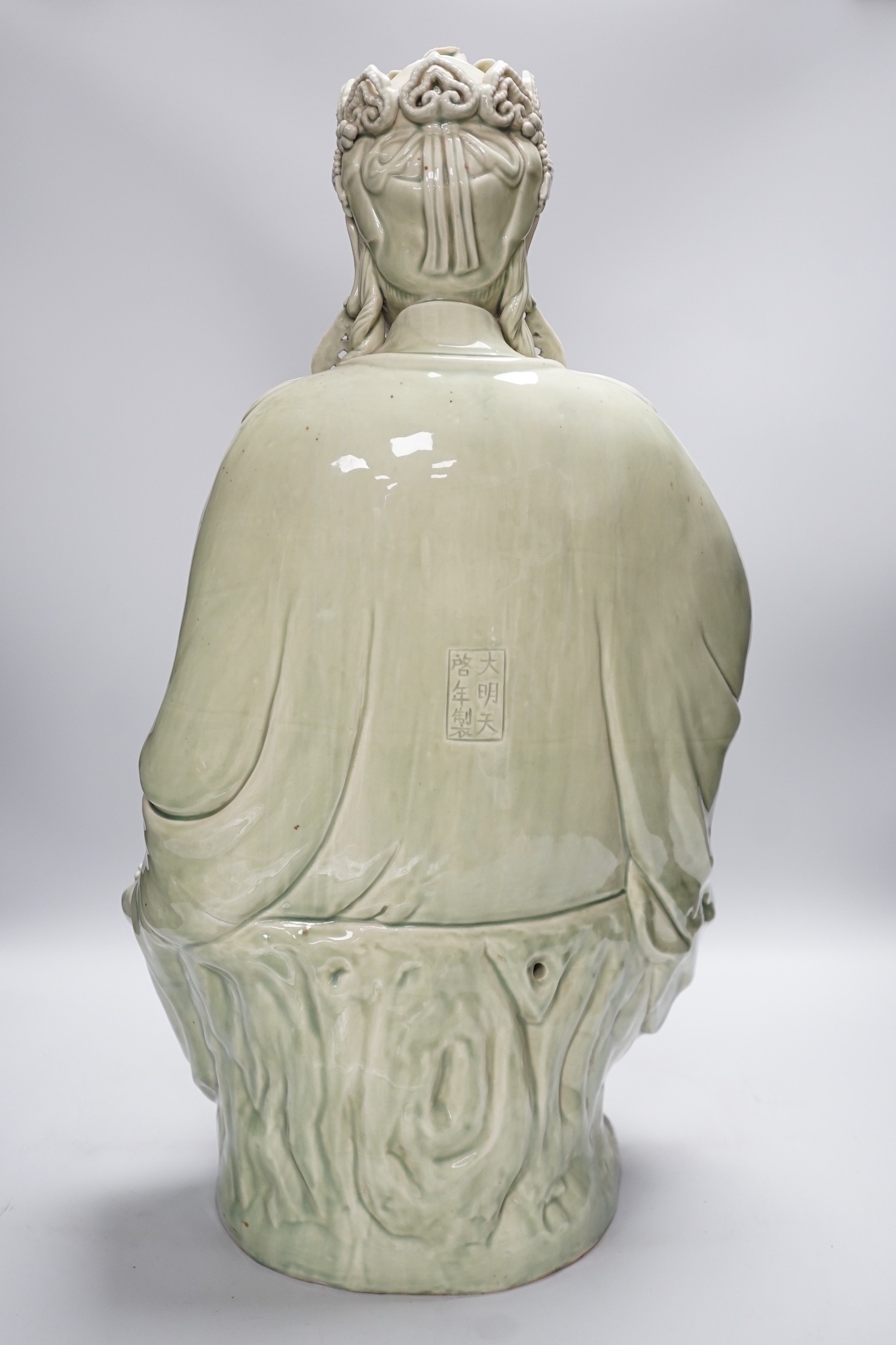 A Chinese celadon glazed empress figure, 55cm